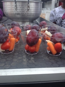 Purple sugar plums, red grape tomatoes, orange carrots, and white jicama make for a great color scheme in the cups! 